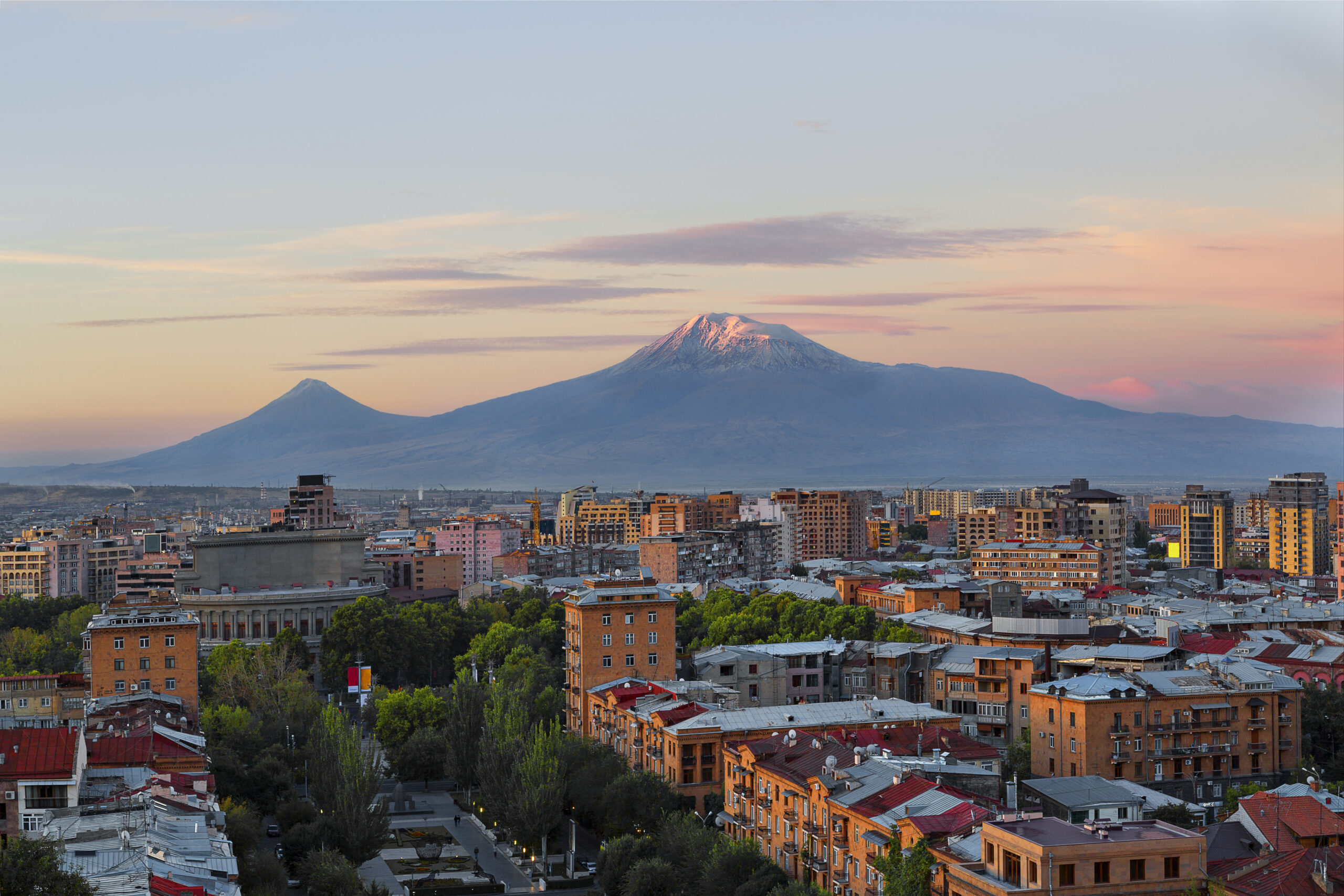 Yerevan in Armenia and the two peaks of the Mount Ararat at the sunrise.